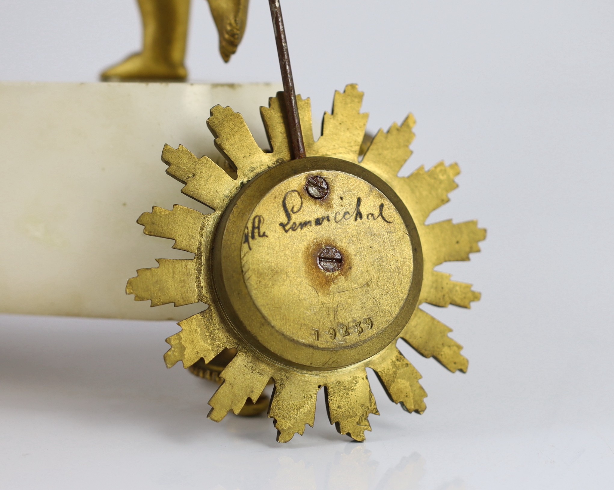 A French Louis XVI style ormolu and white marble mantel clock, 26cm wide, 48cm high